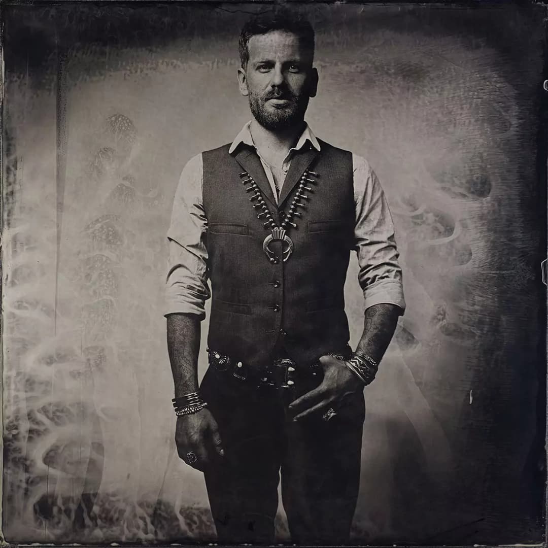Collodion picture of a man with Navajo jewelry by Harpo.