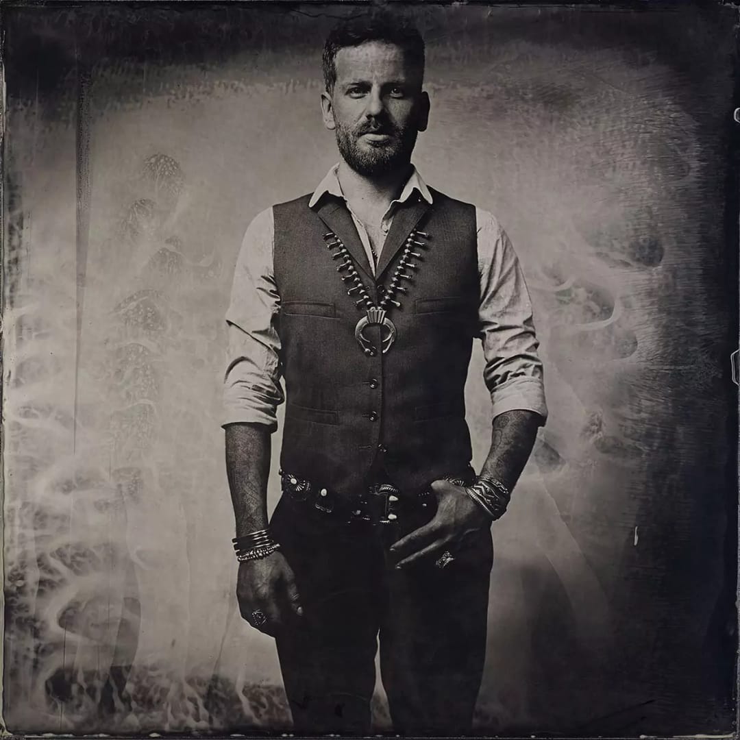 Collodion picture of a man with Navajo jewelry by Harpo.