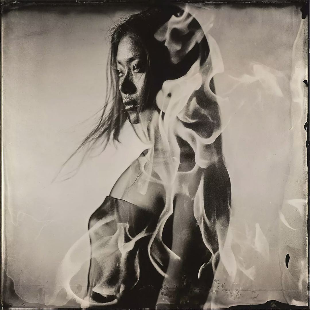 Collodion double exposure vietnamese woman with flame.