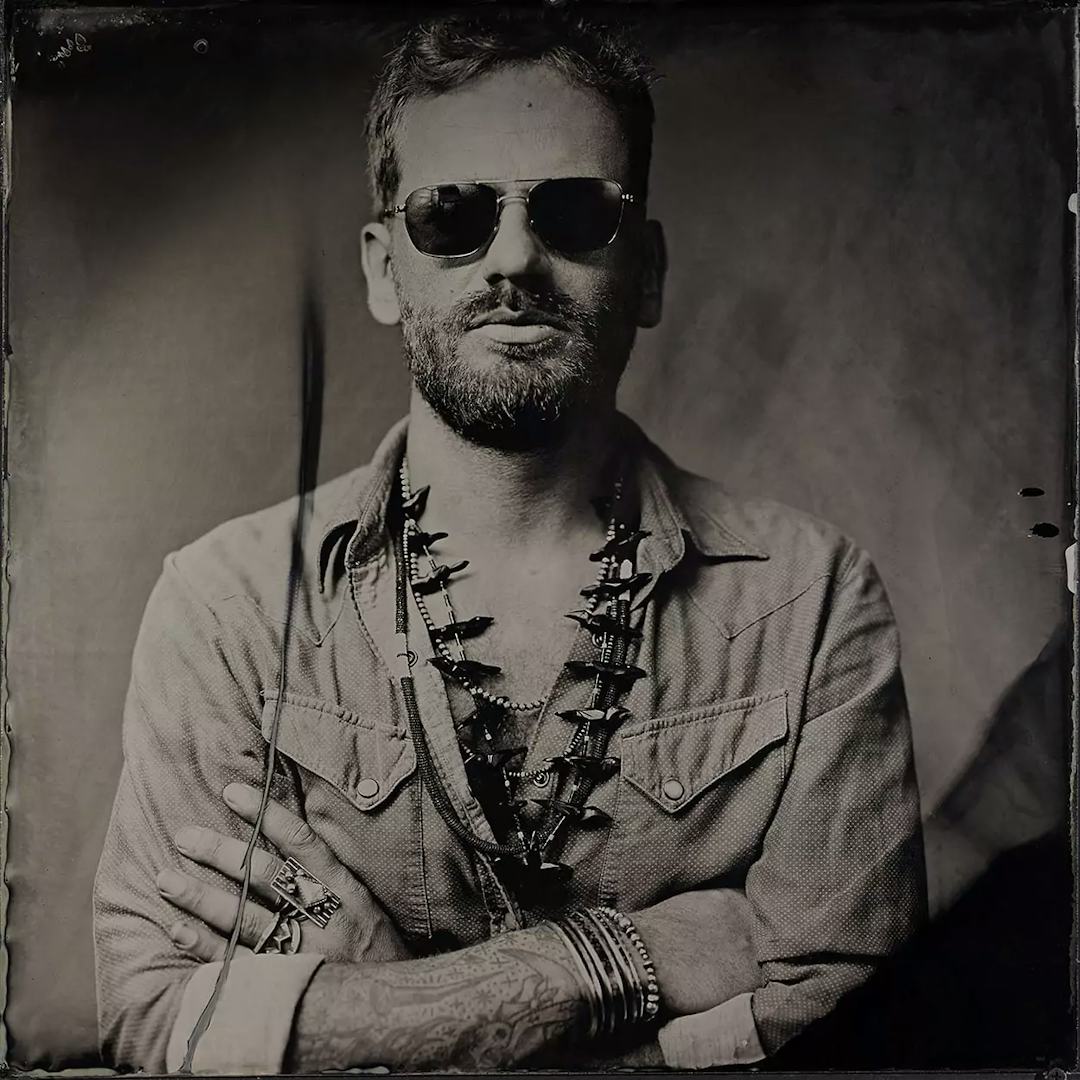 Collodion picture of a man with sunglasses and Navajo jewelry by Harpo.