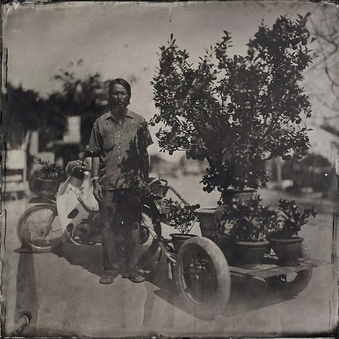 Collodin picture of Vietname man delivering flowers.