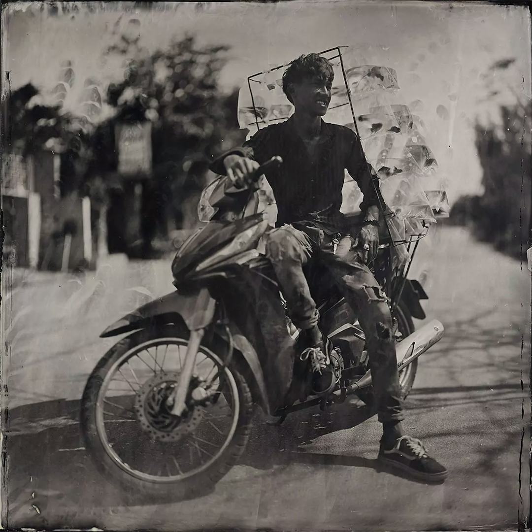 Collodin picture of Vietnamese man on his motorcycle.