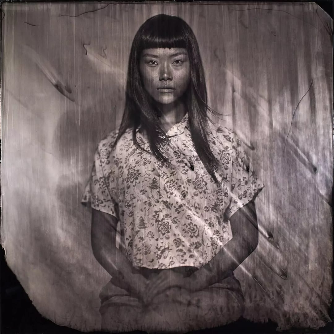 Collodion picture of Vietnamese woman sitting in front of the objectif.