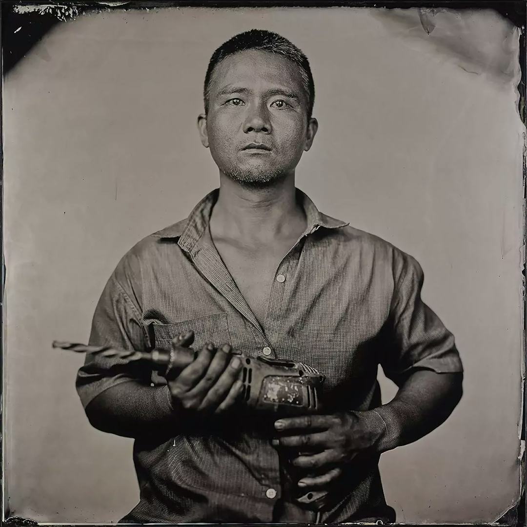 Collodion picture of a Vietnamese man holding a driller.